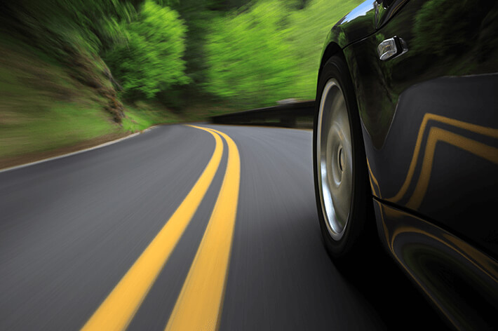 Car driving near yellow line